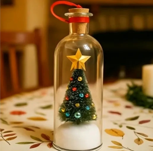 Mini snowy Christmas tree inside clear glass bottle ornament